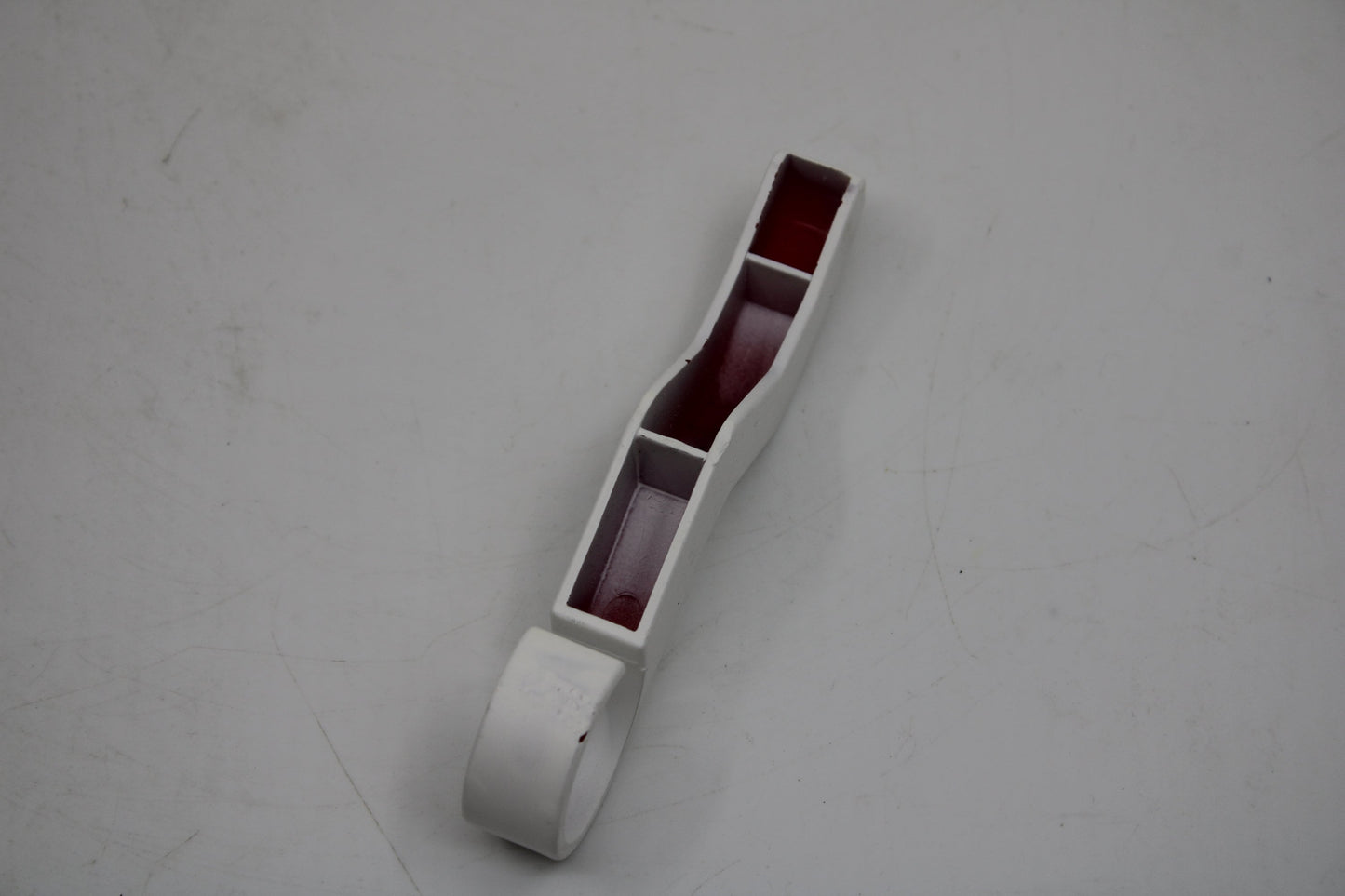 Original and used Maxi Swatch pin for buckle, painted white