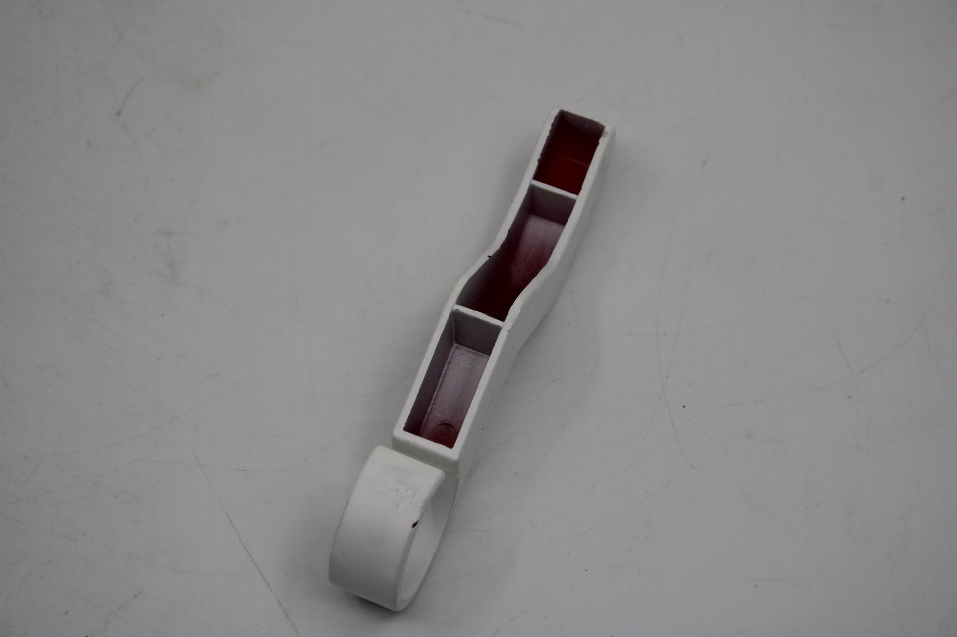 Original and used Maxi Swatch pin for buckle, painted white