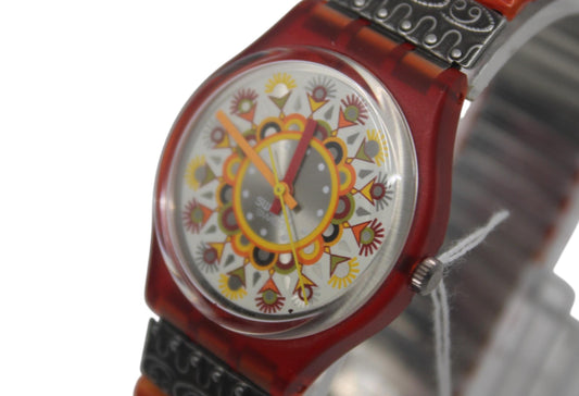 This is a rare, vintage Swatch watch called the Curry Powder, model number GR125. This watch is unworn, new old stock.